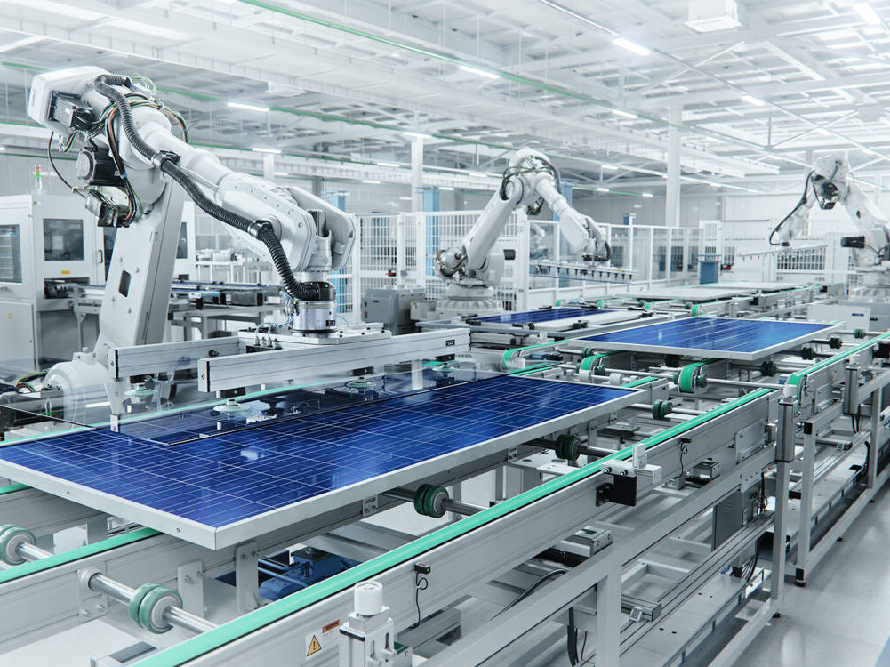 Wide Shot of Solar Panel Production Line with Robot Arms at Modern Bright Factory. Solar Panels are being Assembled on Conveyor.